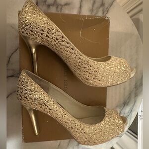 Audrey Brooke Woven Peep-Toe Heels in gold sparkle.